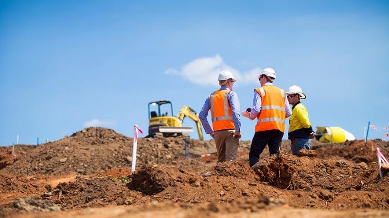 Geotechnical Engineers on construction site preparing to complete field work