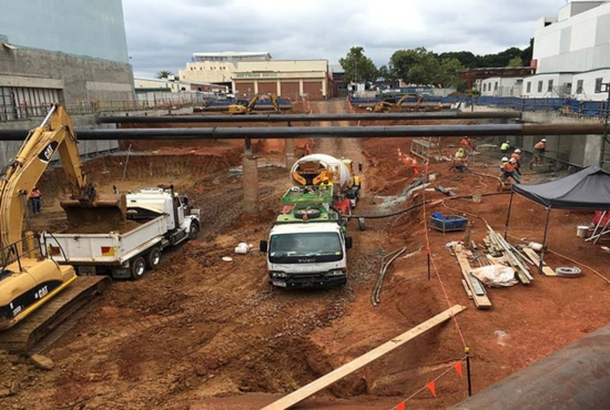 A construction team preparing the foundation of a project site